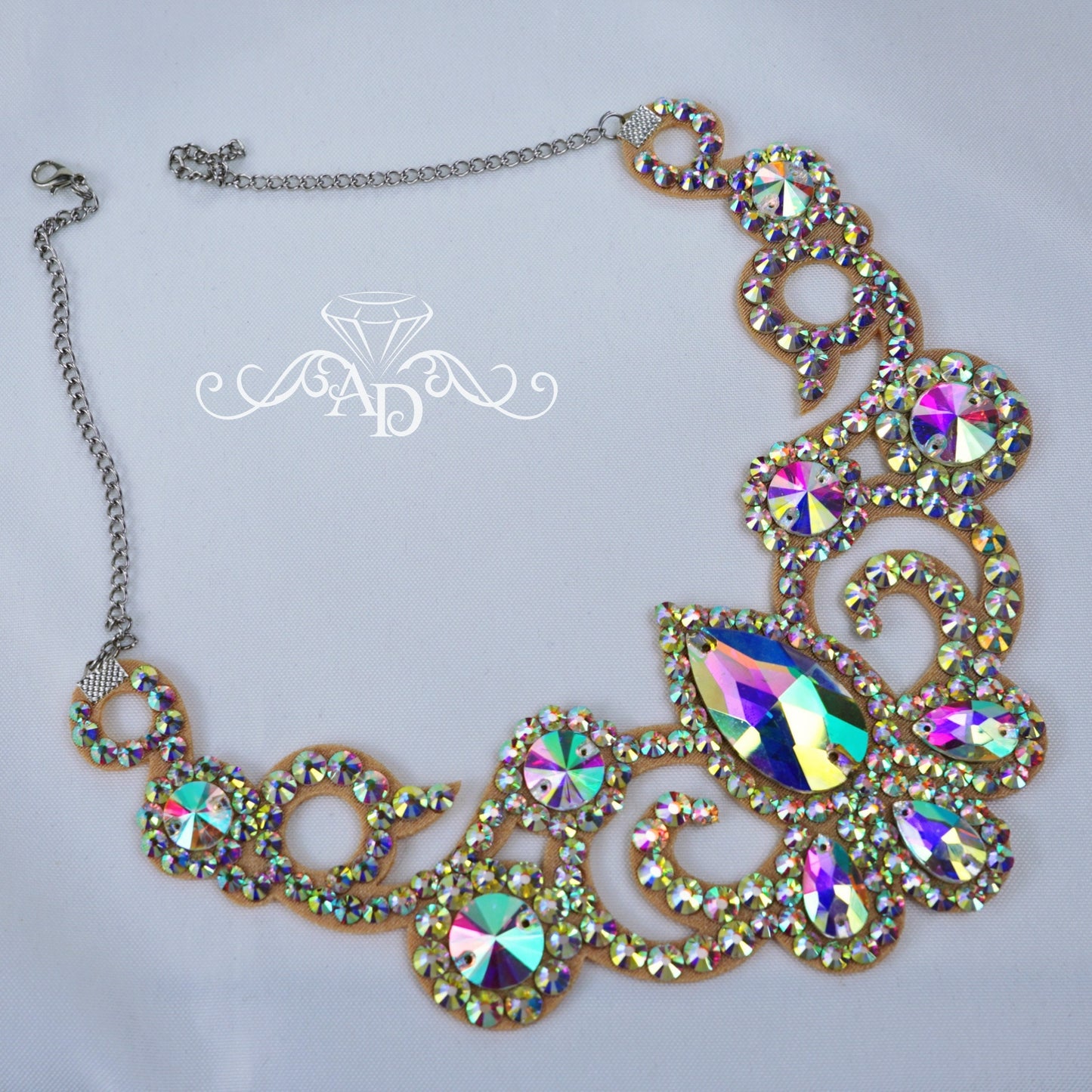 Crystal AB rhinestone necklace with teardrop centerpiece and ornate circular accents, crafted for bellydance costumes and stage performances.