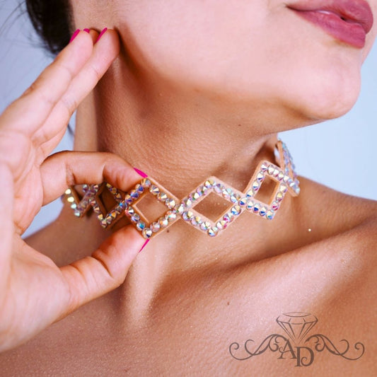 Close-up of a woman wearing a crystal AB rhinestone choker with geometric diamond shapes, designed for ballroom and latin dance performances.