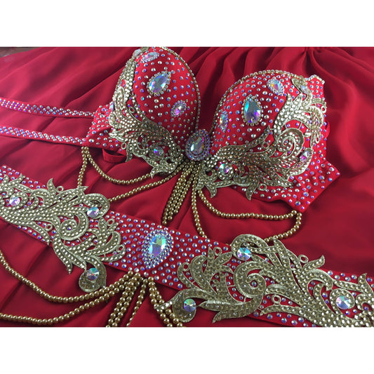 Red rhinestone belly dance costume with bra, ornate belt, chiffon circle skirt.